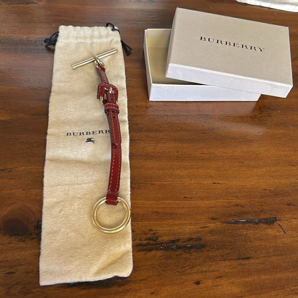Burbbery Leather gold hardware lock impeccable Burgundy color